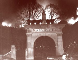 The motherhouse building burning.